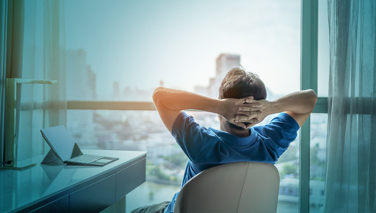 A picture showing a man resting in the office