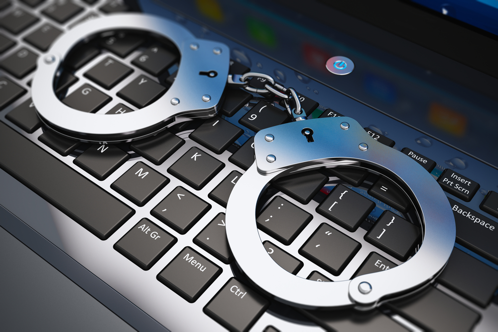 cybercrime and handcuffs